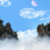 Wall Mural Mountain peaks above the clouds M0699