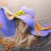 Wall mural Sculpture woman purple hat butterflies M5279
